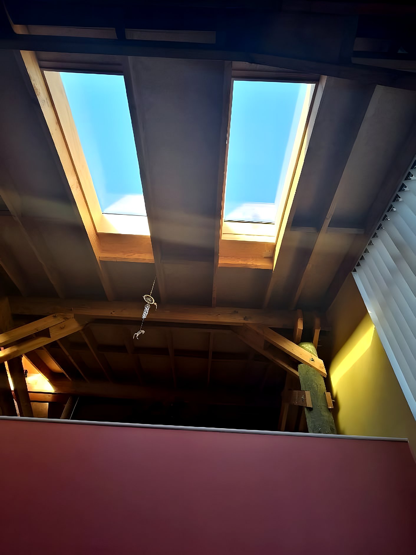 Two skylights seen from below through the light well